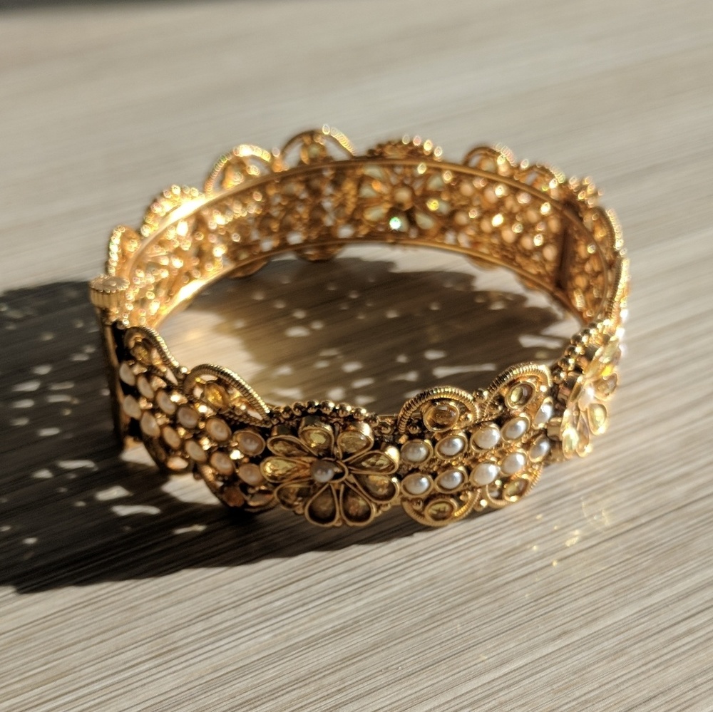 Intricate gold pearl and crystal cuff bracelet